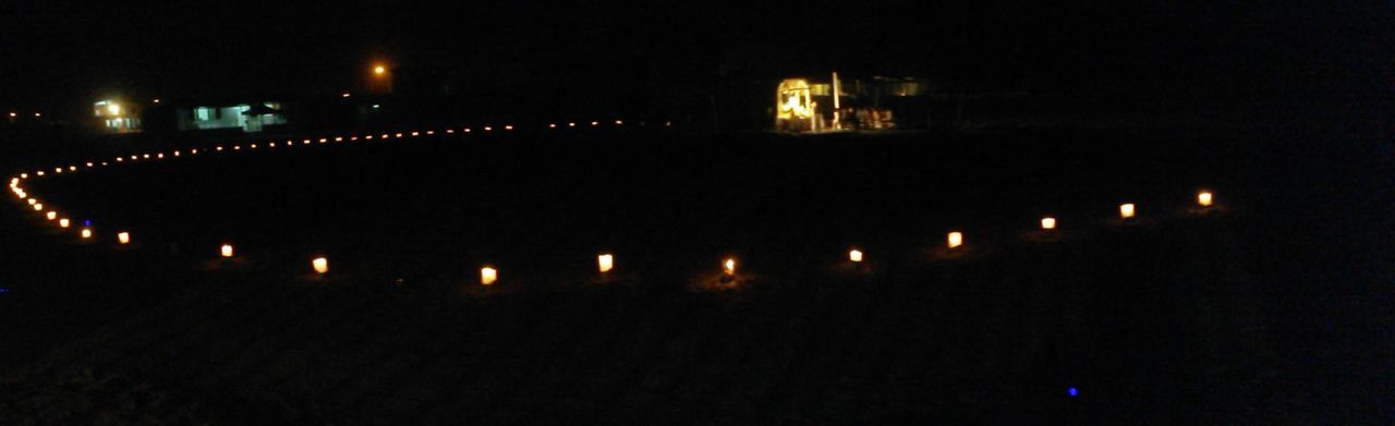 VIEW OF ILLUMINATED LIGHTS IN DARK