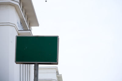 Low angle view of security camera against clear sky