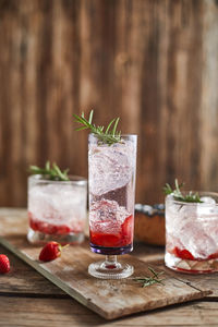 Close-up of drinks on wooden table