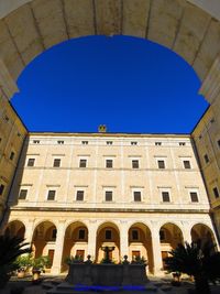 Low angle view of building against blue sky