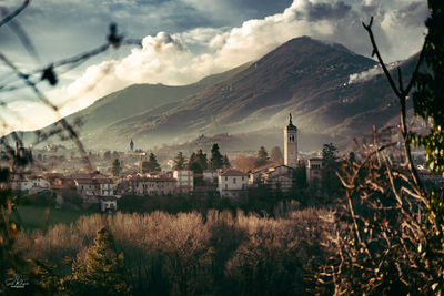 View of buildings against cloudy sky