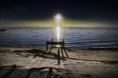 Scenic view of sea against sky at night