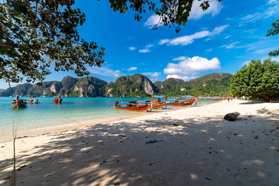 Scenic view of beach against blue sky