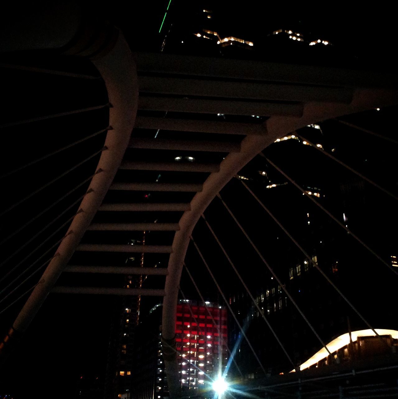 illuminated, night, built structure, architecture, low angle view, lighting equipment, building exterior, transportation, dark, the way forward, light - natural phenomenon, no people, indoors, city, railing, staircase, metal, steps and staircases, modern