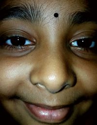 Close-up portrait of smiling girl