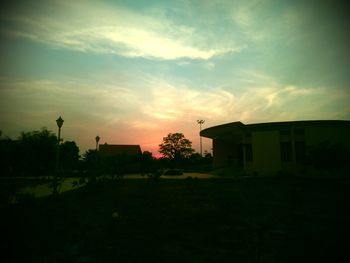 Built structure on field at sunset