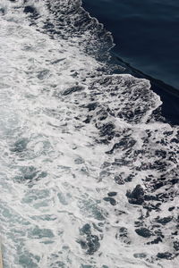 High angle view of water flowing in sea
