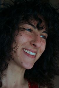 Close-up portrait of smiling young woman