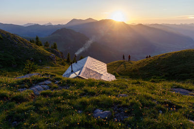 Scenic view of mountains against sky during sunset