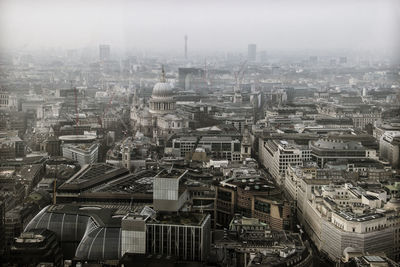 High angle view of buildings in city against sky