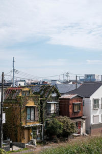 Buildings in city against sky