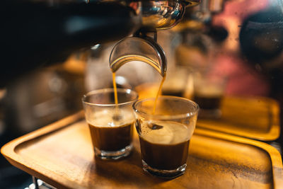 Close-up of coffee in glass on table