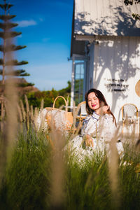 Young woman sitting on grass