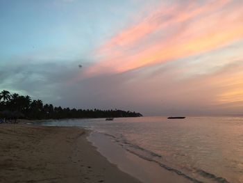 Scenic view of beach against sky during sunset