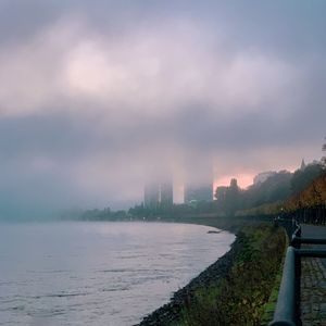 Scenic view of sea and buildings against sky