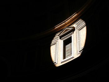 Low angle view of spotlight falling on window