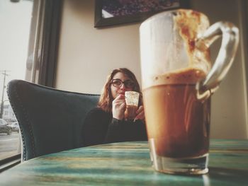 Close-up of woman sitting in restaurant