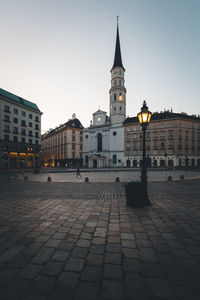 Buildings in city at dusk