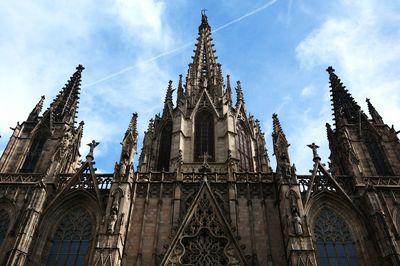 Low angle view of barcelona cathedral against sky