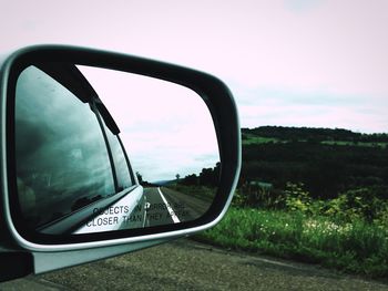 Cropped image of car on road