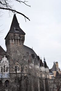 Low angle view of clock tower against sky