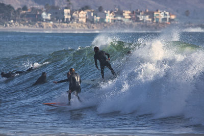 People enjoying in sea