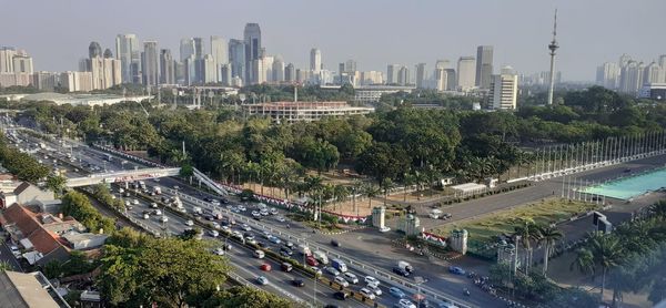 High angle view of street amidst buildings against sky