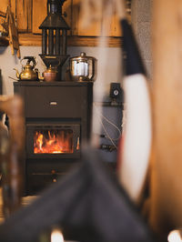 Metal fireplace in traditional mountain cottage.