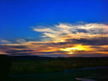 Scenic view of landscape against cloudy sky