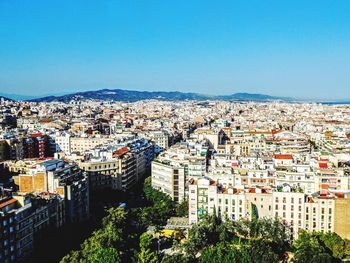 High angle shot of townscape against clear blue sky