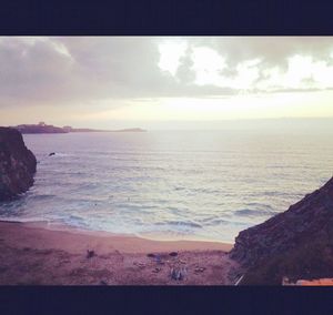 Scenic view of sea against cloudy sky