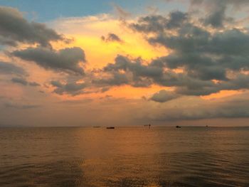 Scenic view of sea against sky at sunset