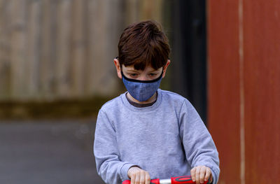 Portrait of boy standing outdoors