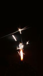 Close-up of illuminated fireworks at night