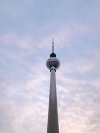 Low angle view of communications tower against sky