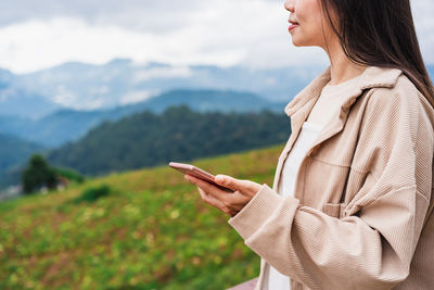 Young woman using mobile phone