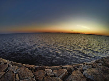 Scenic view of sea at sunset