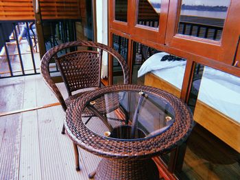 High angle view of empty chairs and table in building