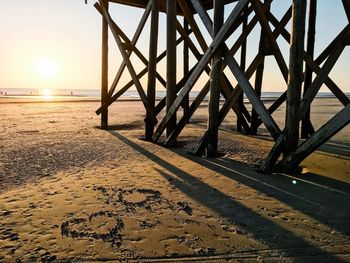 Scenic view of beach against sky during sunset