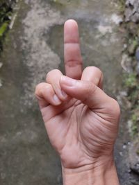 Close-up of person hand on floor