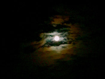 Low angle view of moon in sky at night