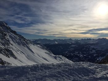 Scenic view of mountains against sky during winter