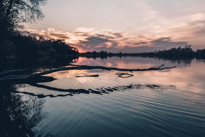 Scenic view of lake against sky during sunset