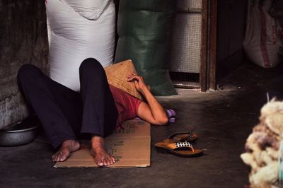 Woman lying on floor at home