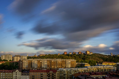 Buildings in town against sky