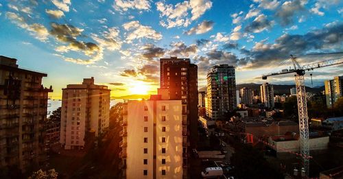 Panoramic view of cityscape against sky during sunset