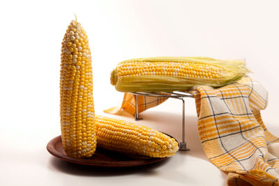 Close-up of corns on table