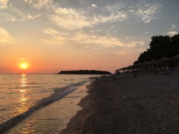 View of beach against sky during sunset