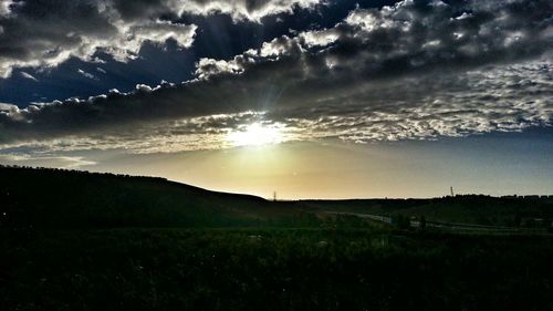 Scenic view of field against sky during sunset