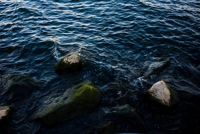High angle view of rocks in sea